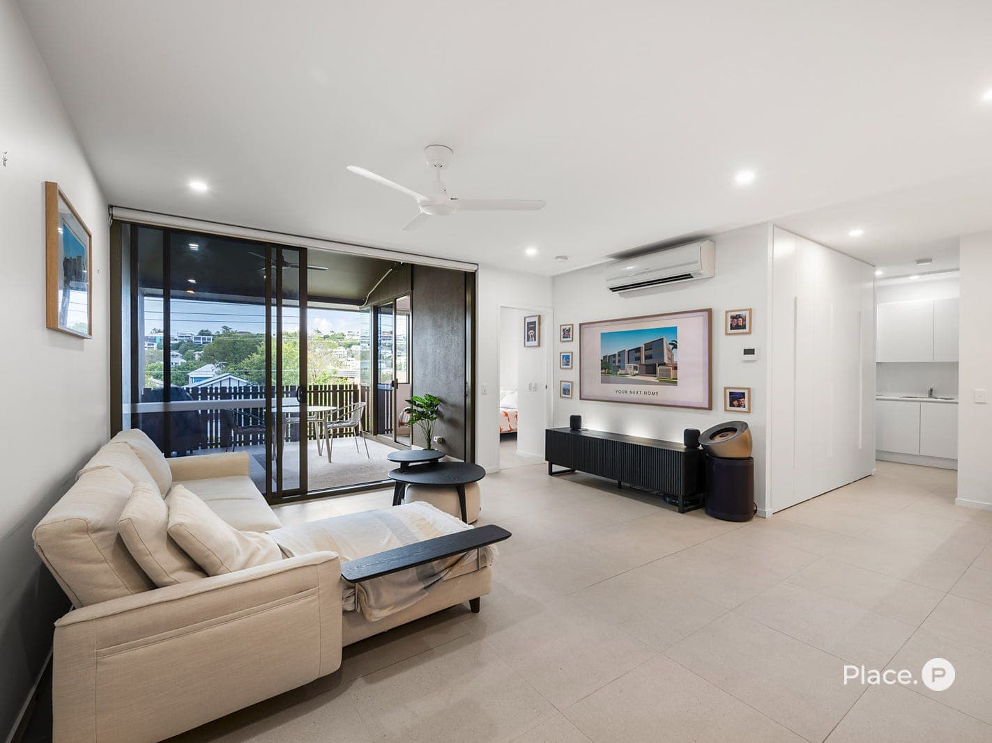 Living area opening to the covered entertaining balcony with elevated outlook